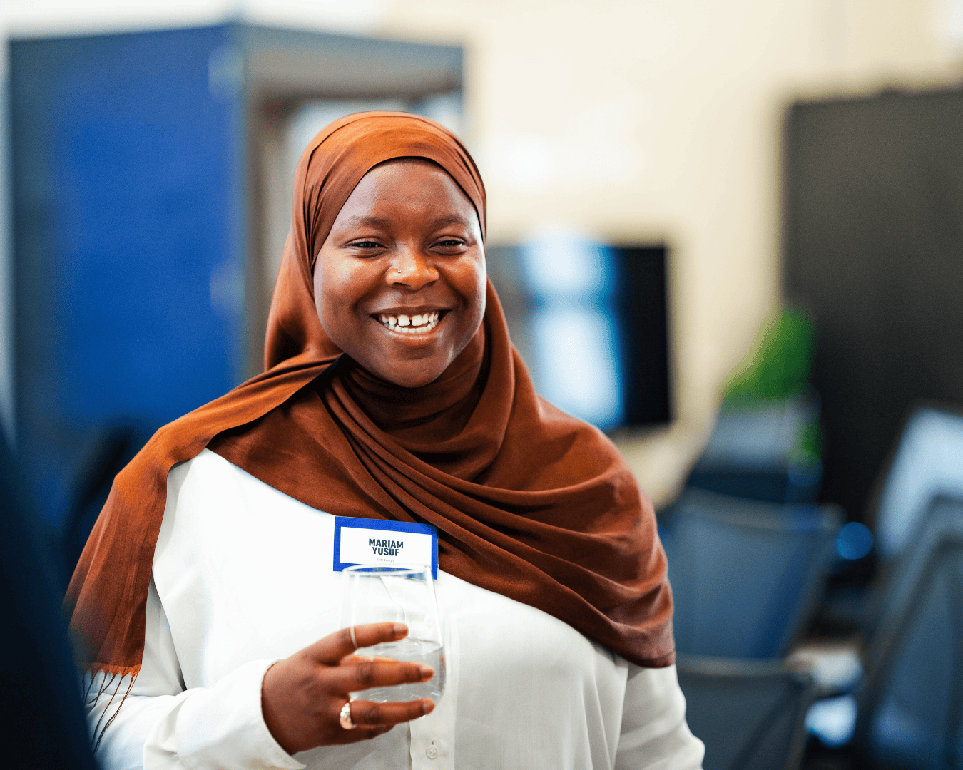 Photo of female wearing a brown head scarf