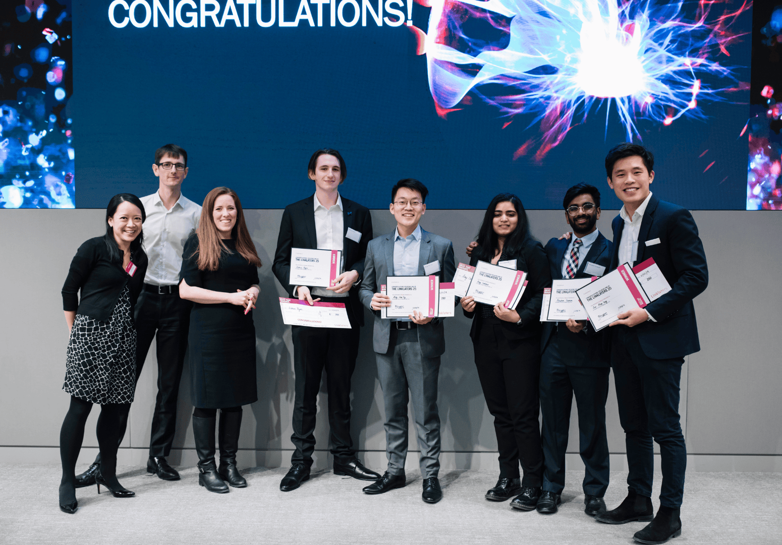Photo of students holding certificates