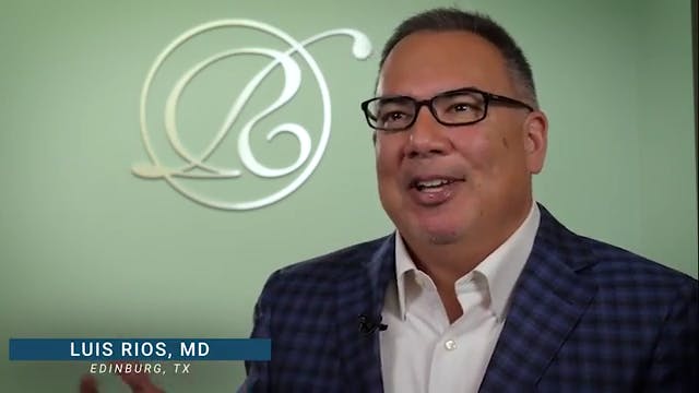 Dr. Rios in a suit in his office