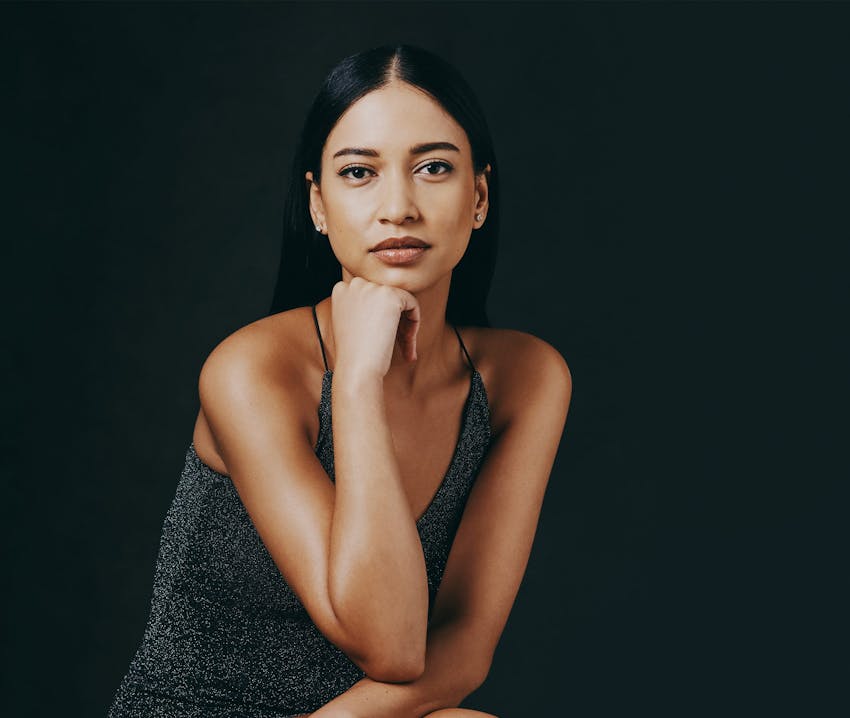 model resting fist against her chin