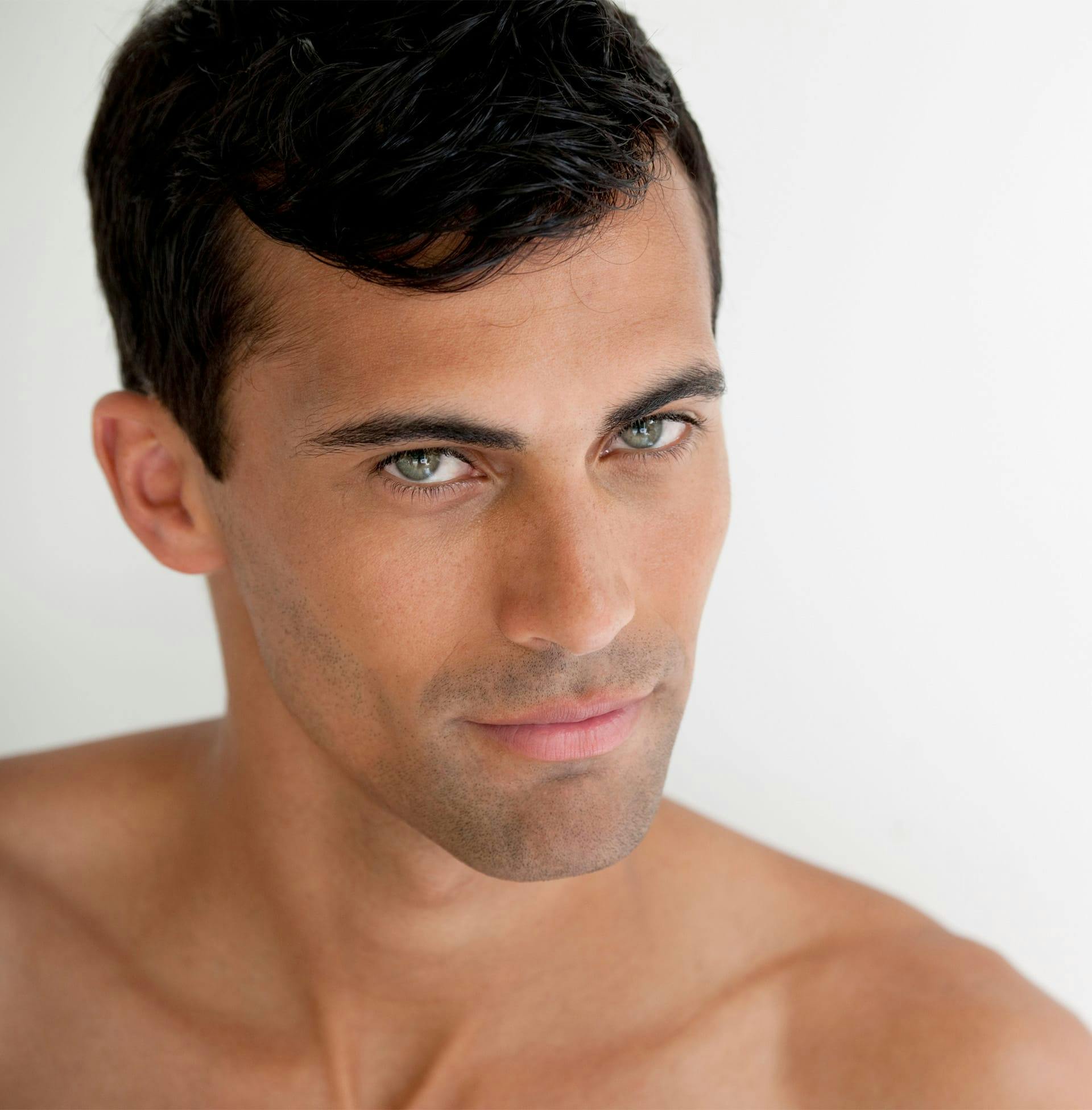 close up of man with black short hair