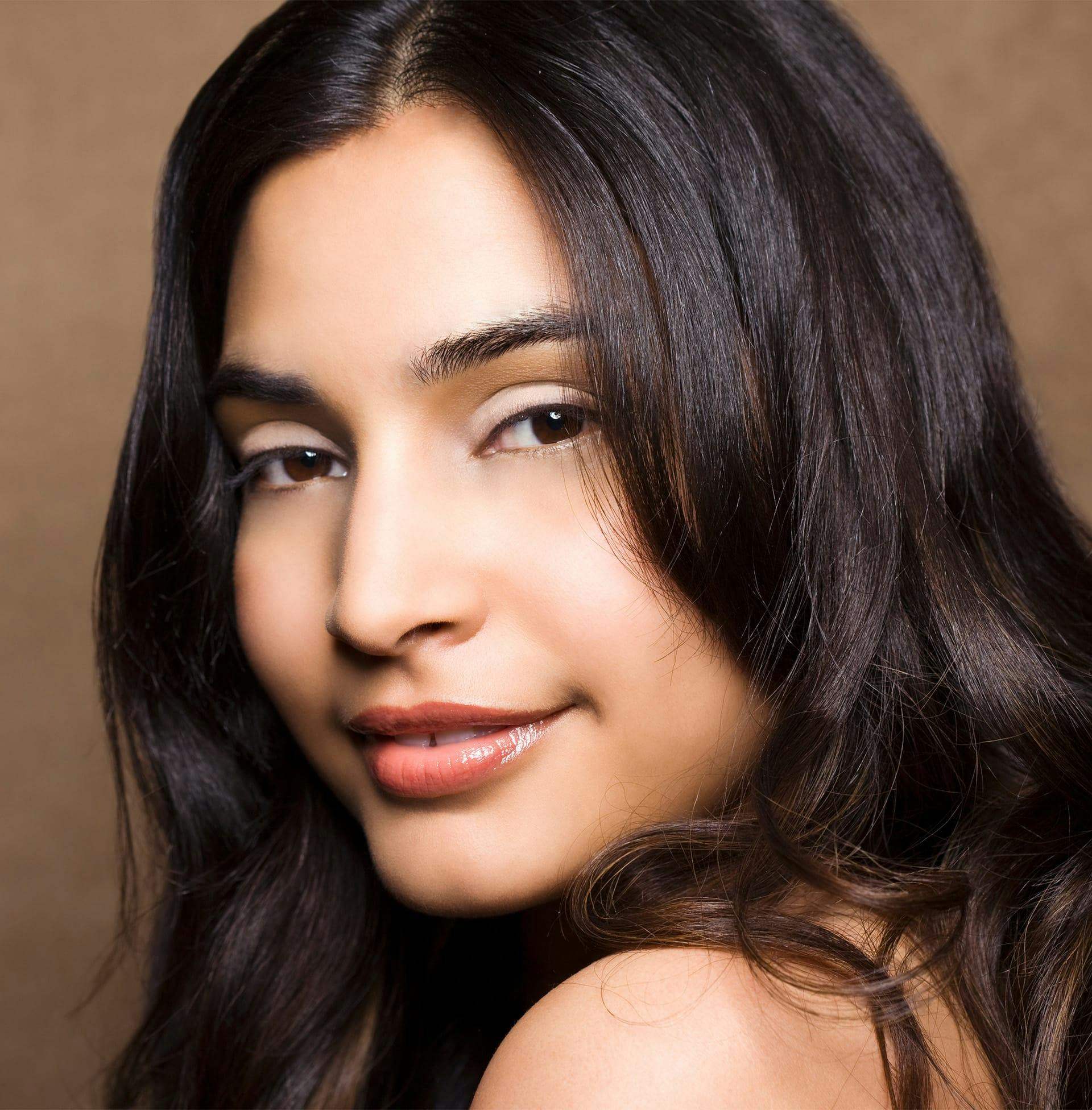 woman looking over her shoulder close up