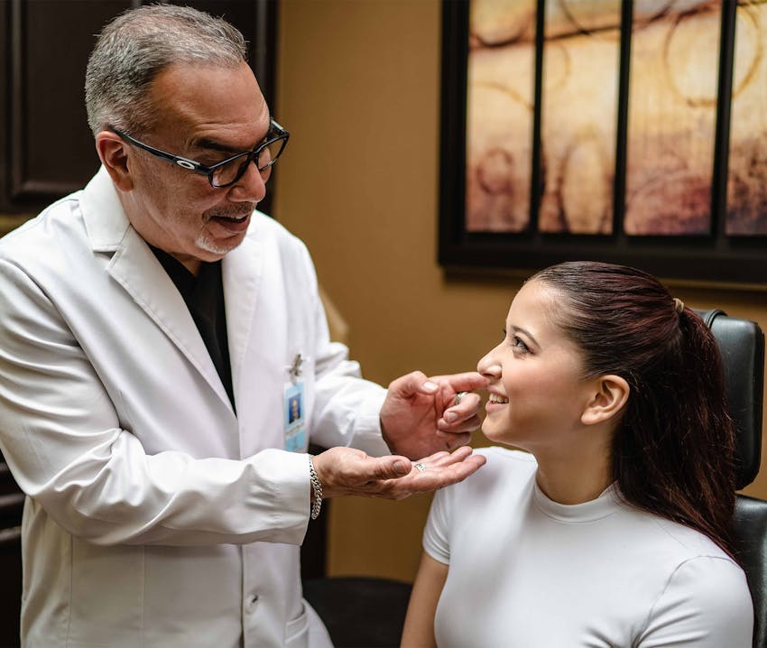 doctor talking to client about her chin