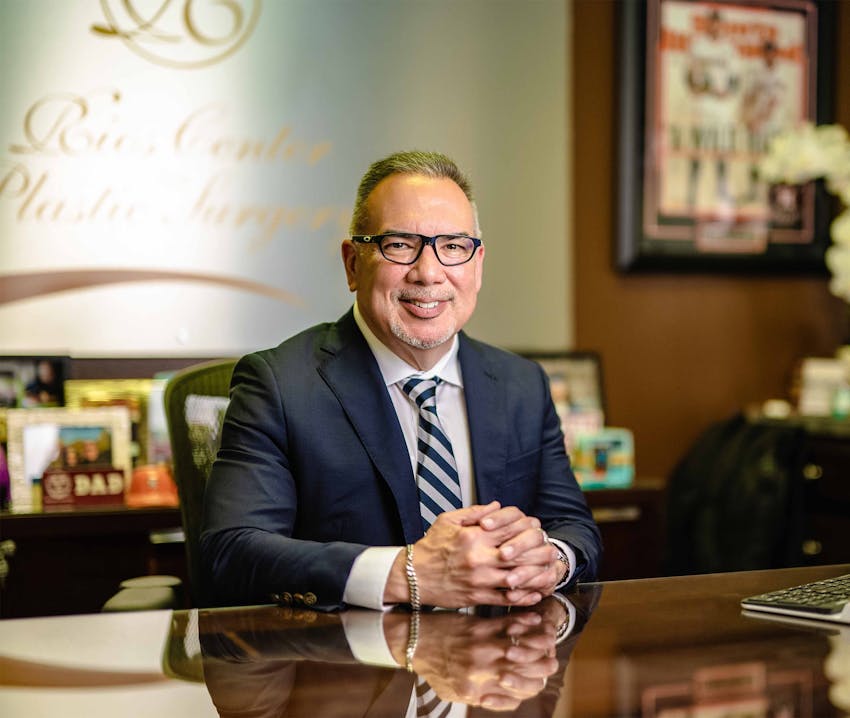 Dr. Rios in tux sitting at table