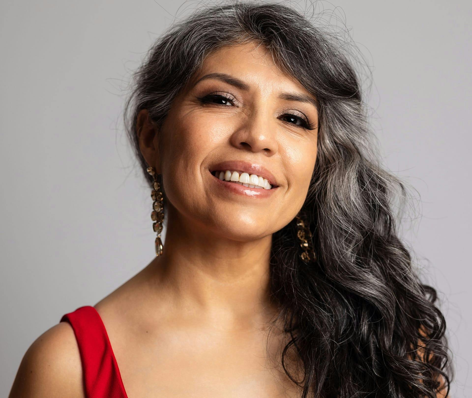 older woman smiling at camera