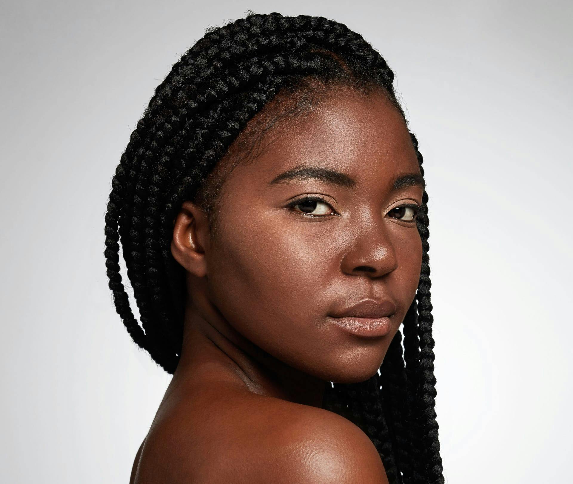 woman looking over her shoulder towards camera