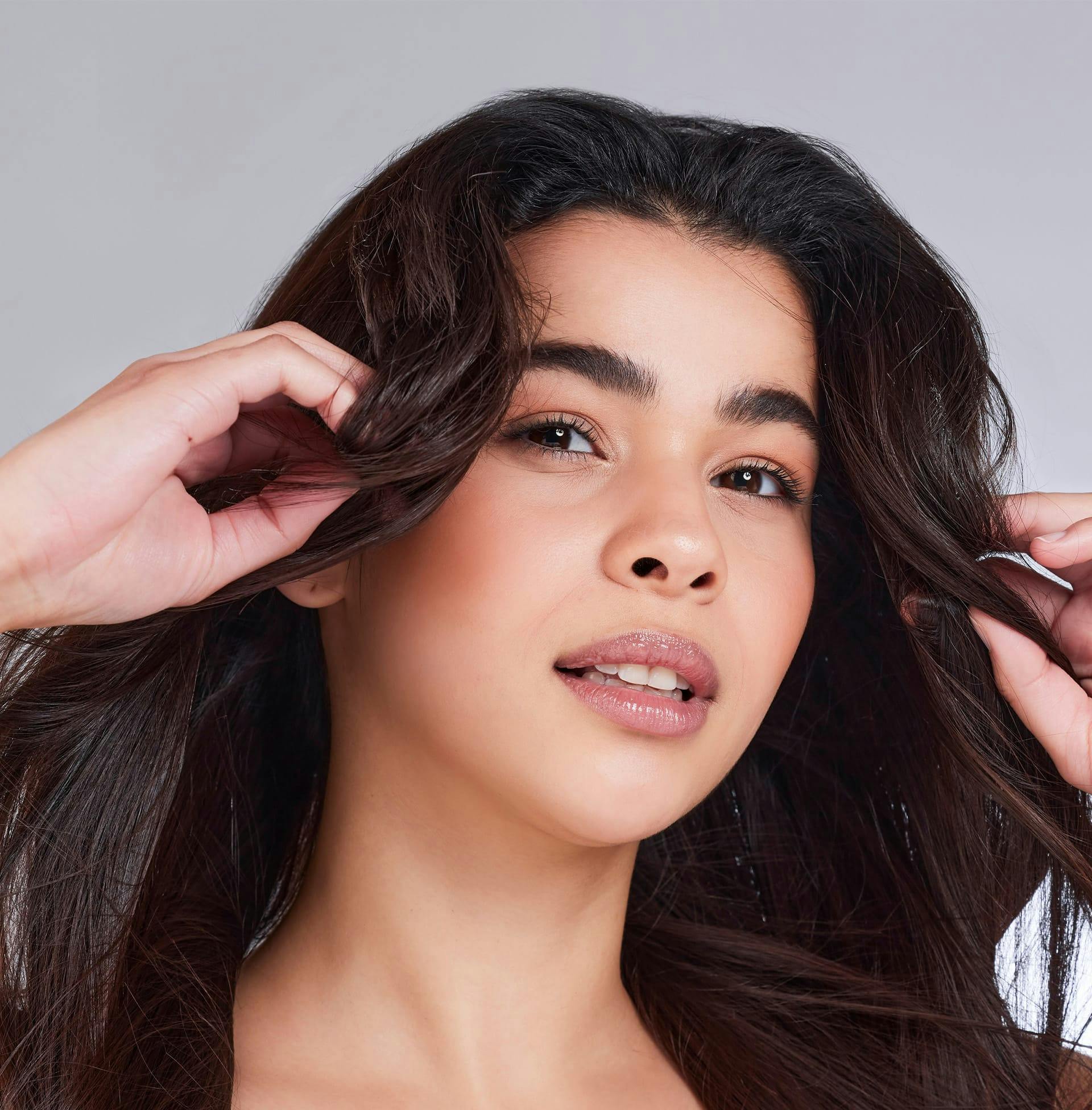 woman with long wavy dark brown hair