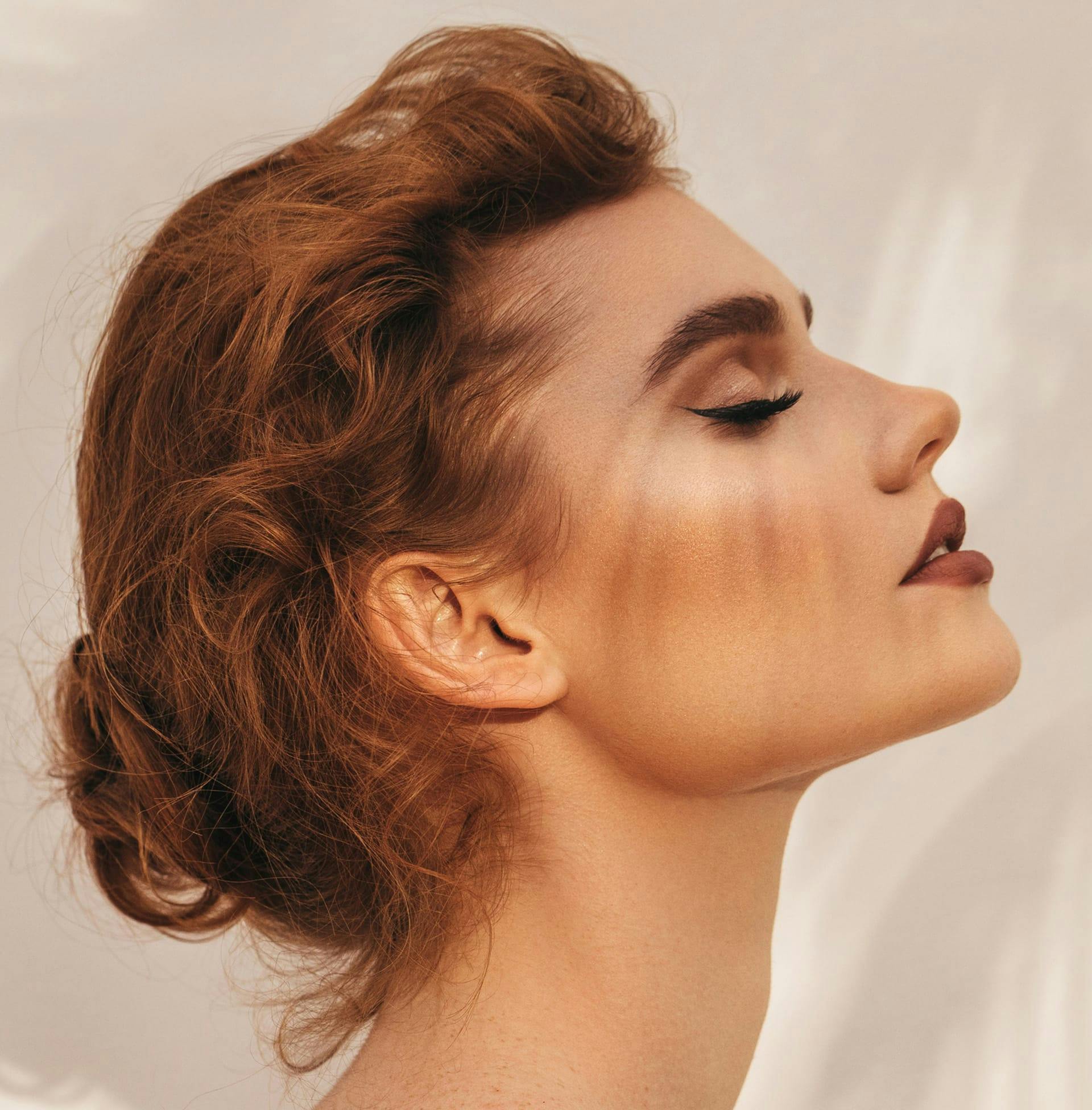 woman in bun showing off the side angle