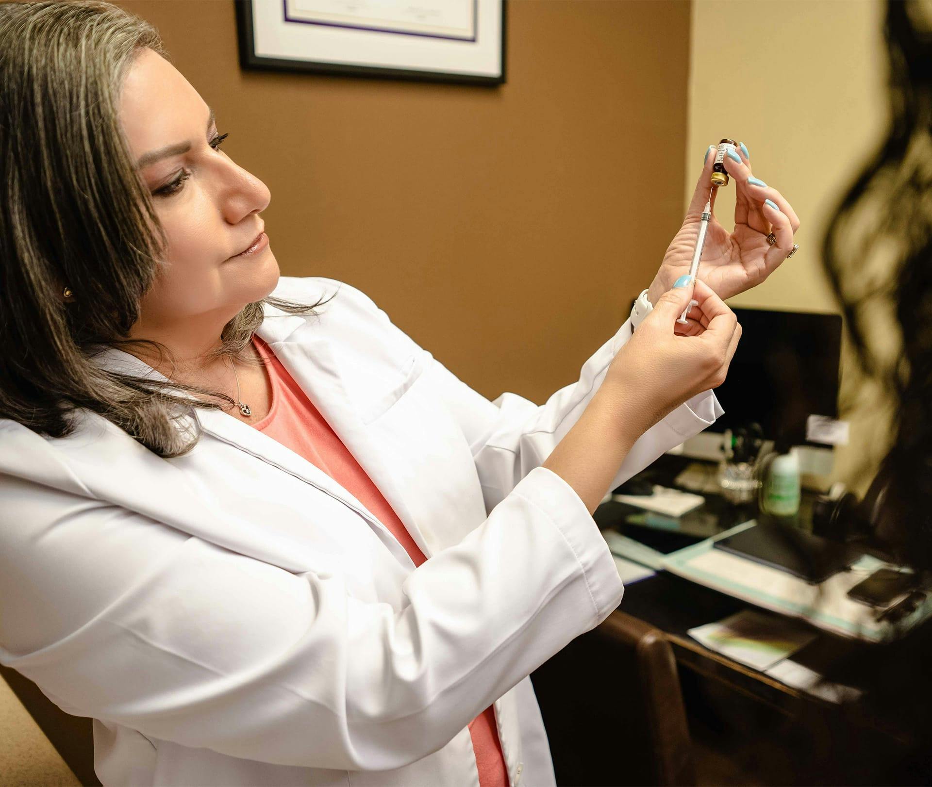 doctor prepping injection shot