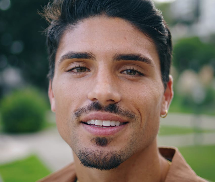 close up of man smiling to camera