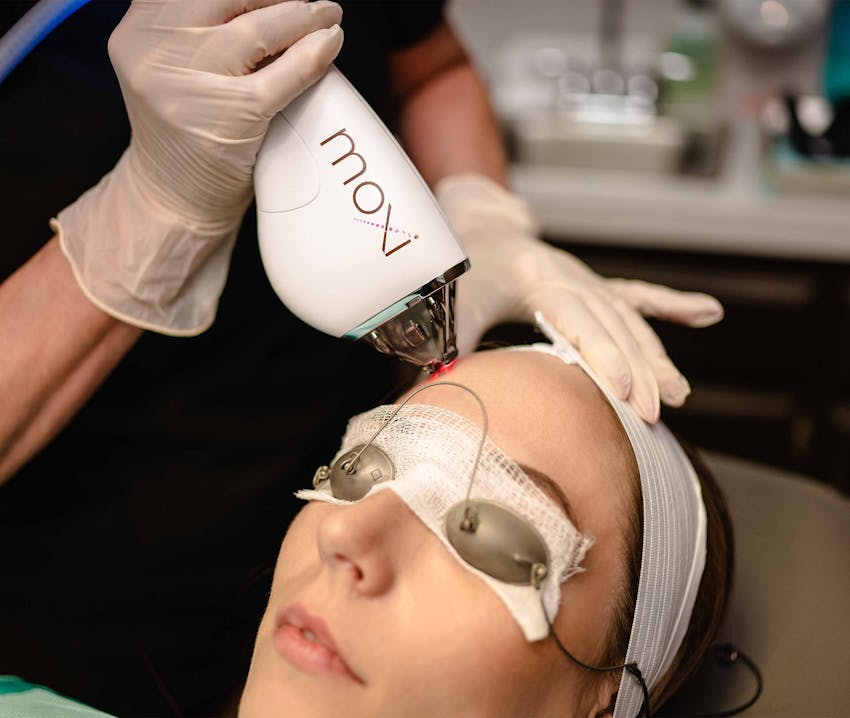 client getting treatment done on forehead