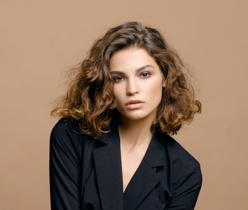 woman with short hair in black shirt
