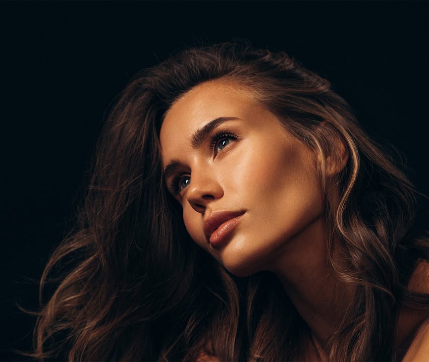 woman facing to the left looking up
