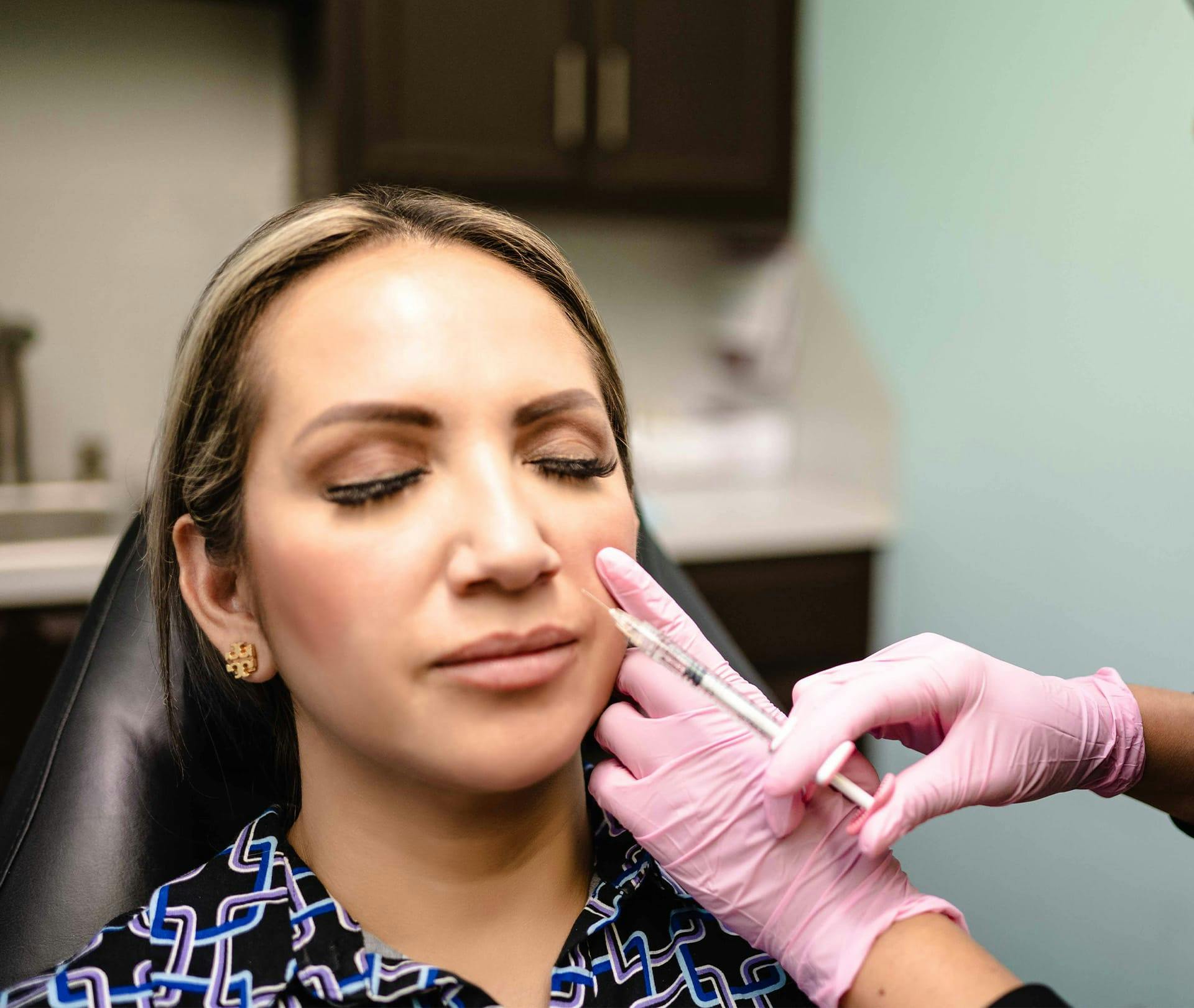 client getting injection in cheek