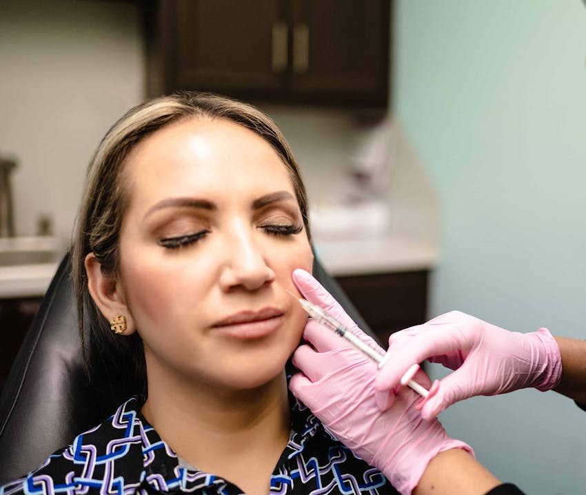 client getting injection in cheek