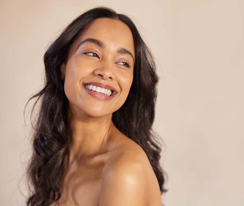 woman looking over her shoulder towards the right