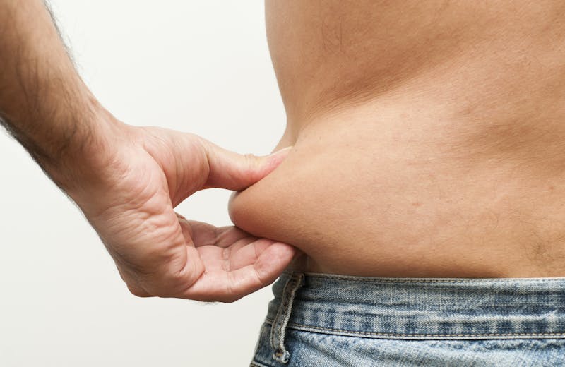 Someone pinching fat.