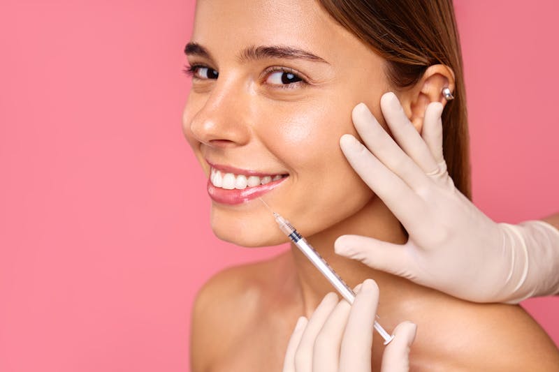 Woman getting injectable MedSpa treatment.