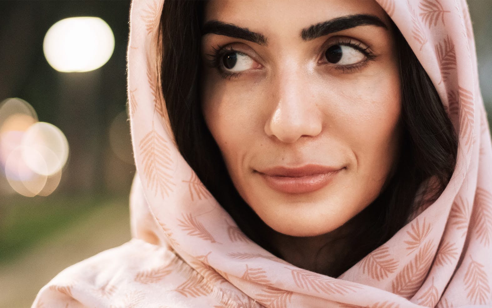 Woman wearing a pink head scarf