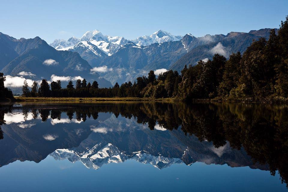 Lake Matheson on beautiful day mirror views of Aoraki/Mount Cook and Mount Tasman in water