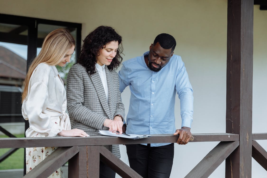 Couple looking at contract with property manager