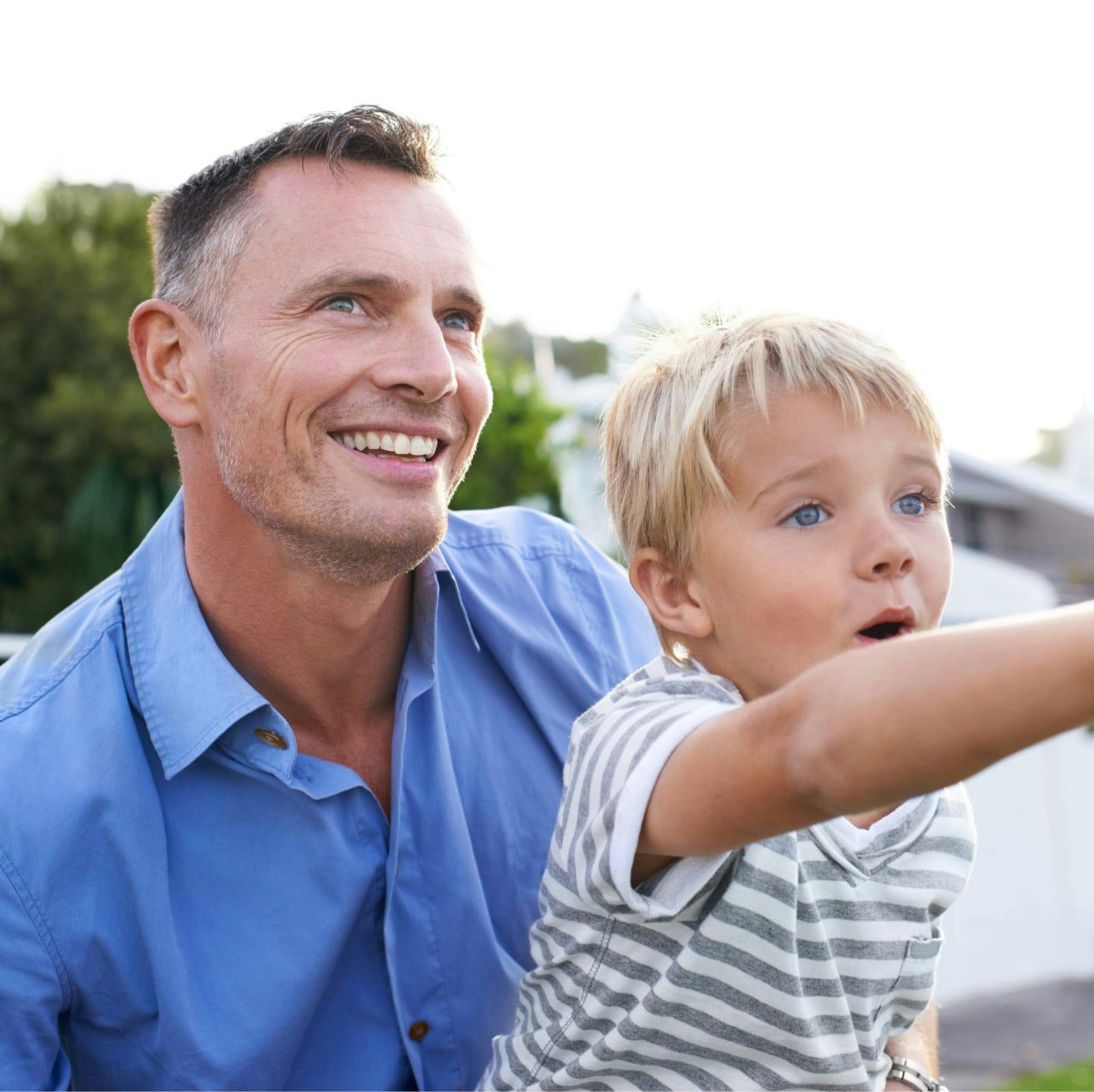 Man with his son on his lap