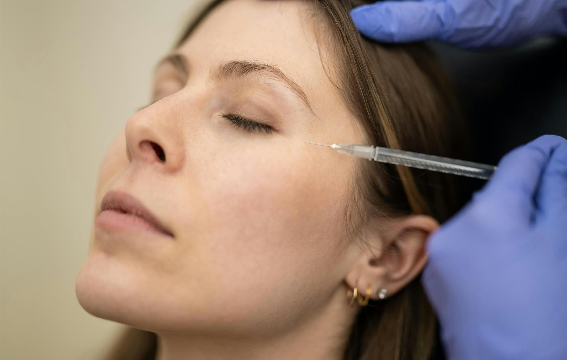 patient receiving botox around eyes