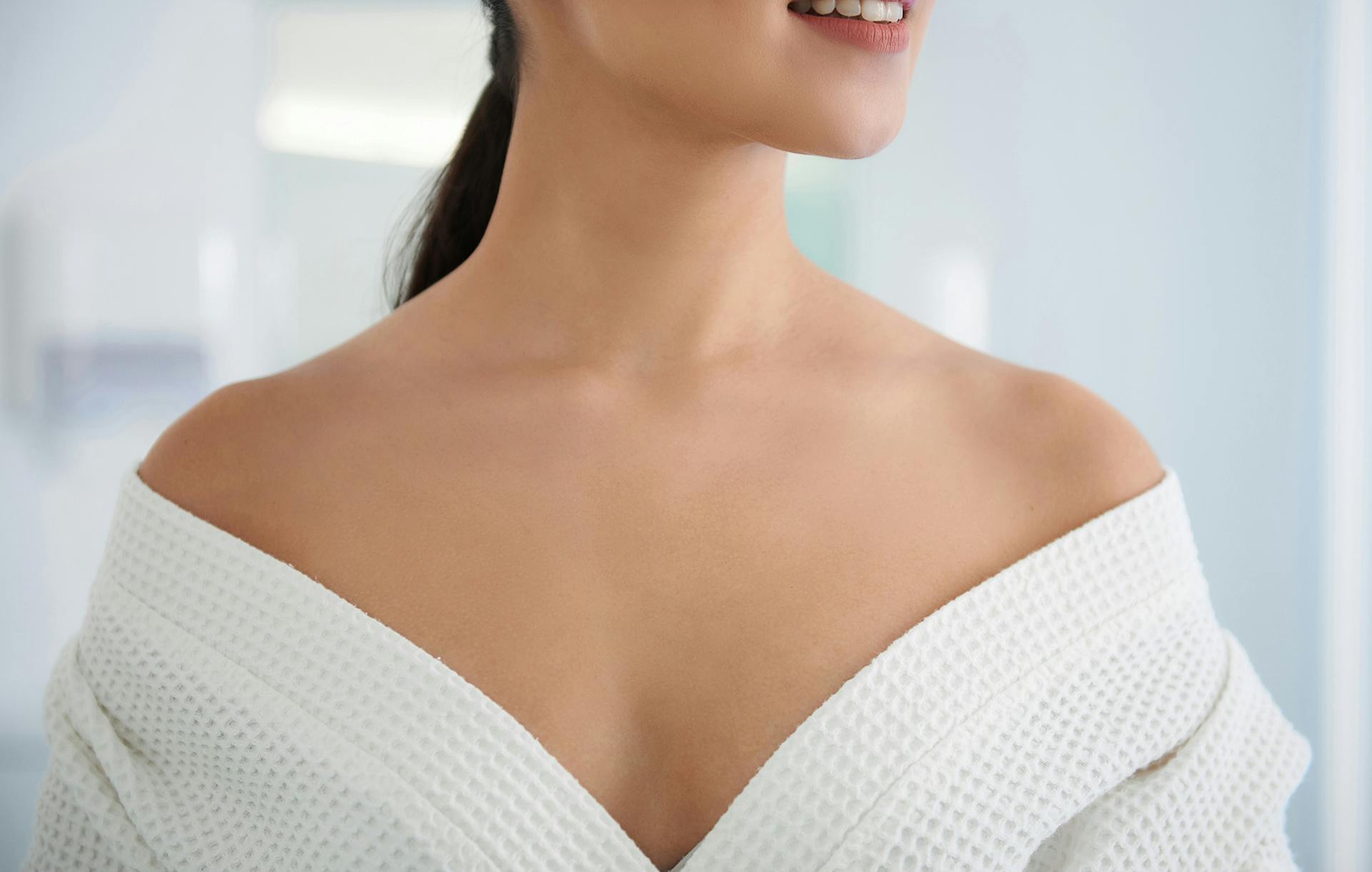 Close up of a womans chest in a white shirt