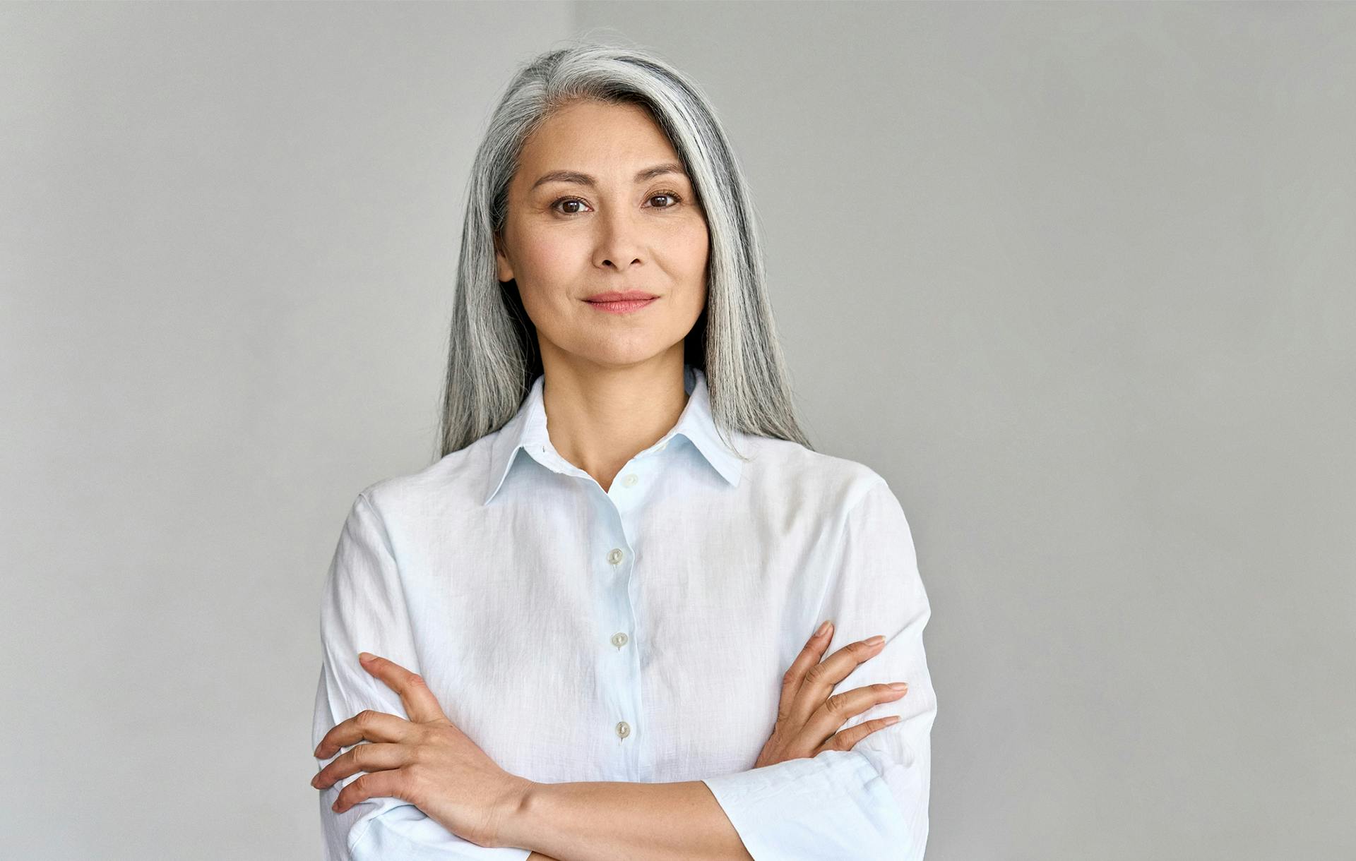 Woman standing with her arms crossed
