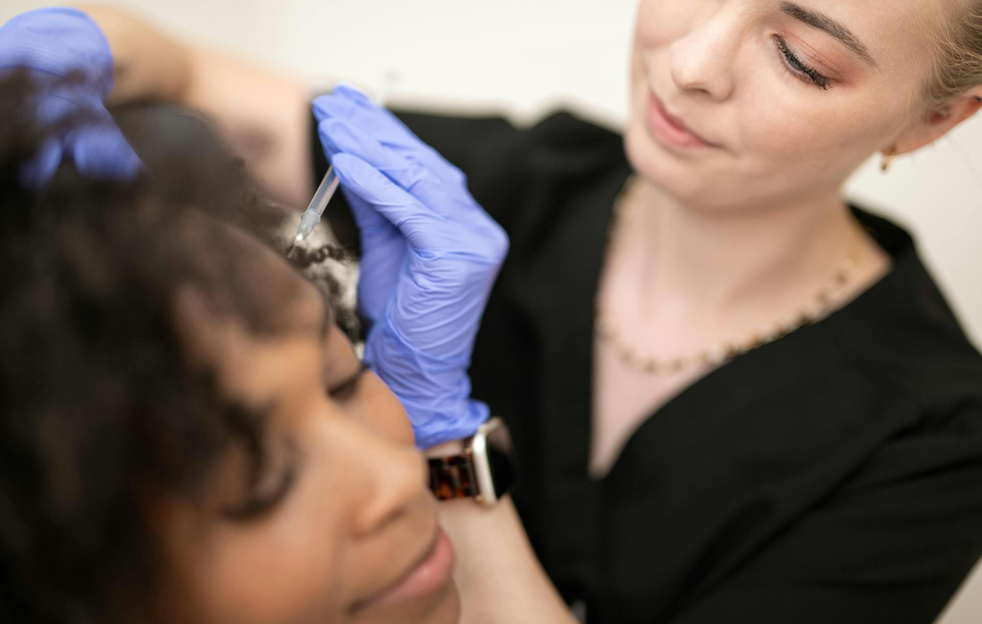 Woman receiving facial injections