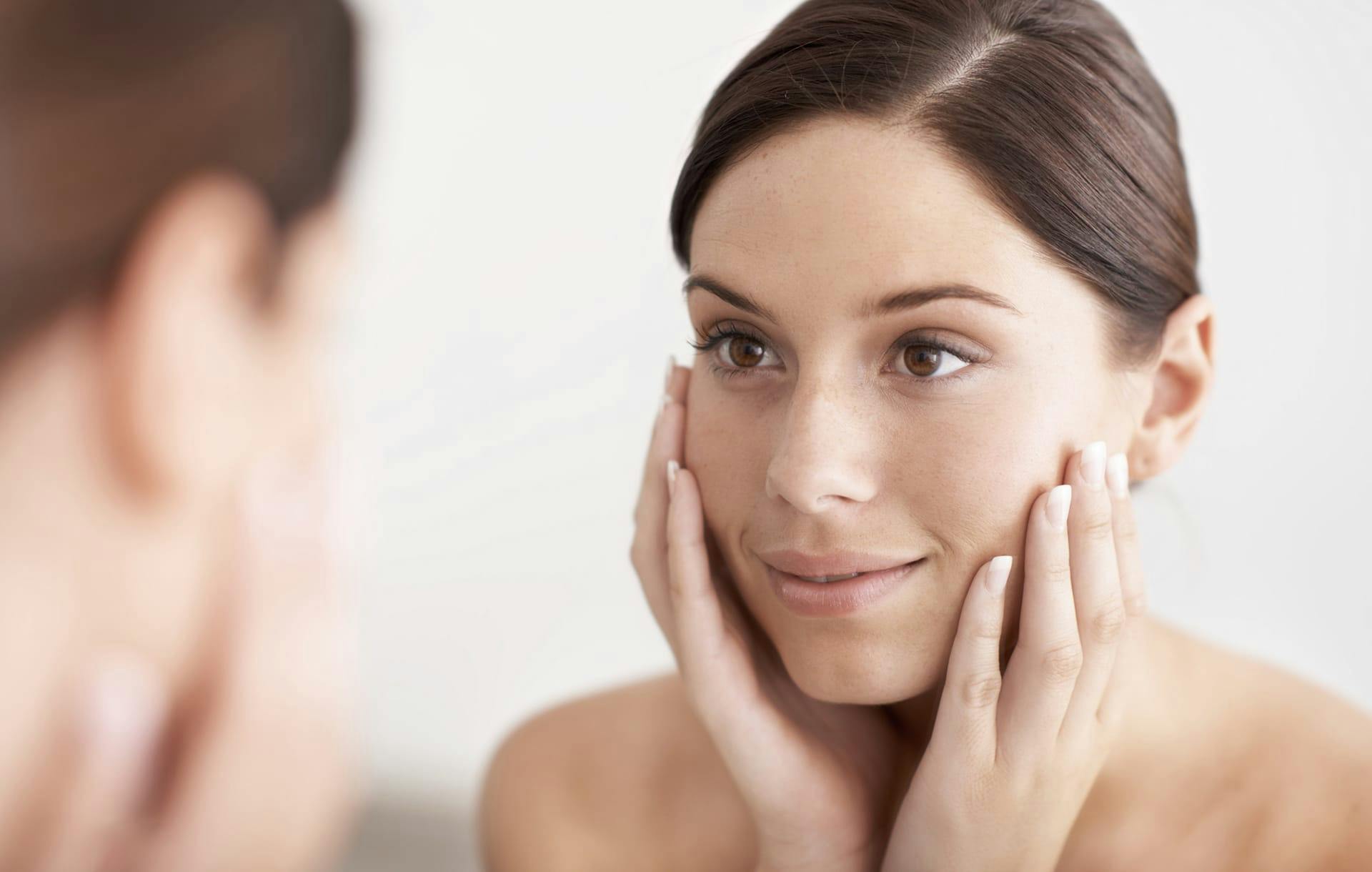 Woman receiving a facial treatment