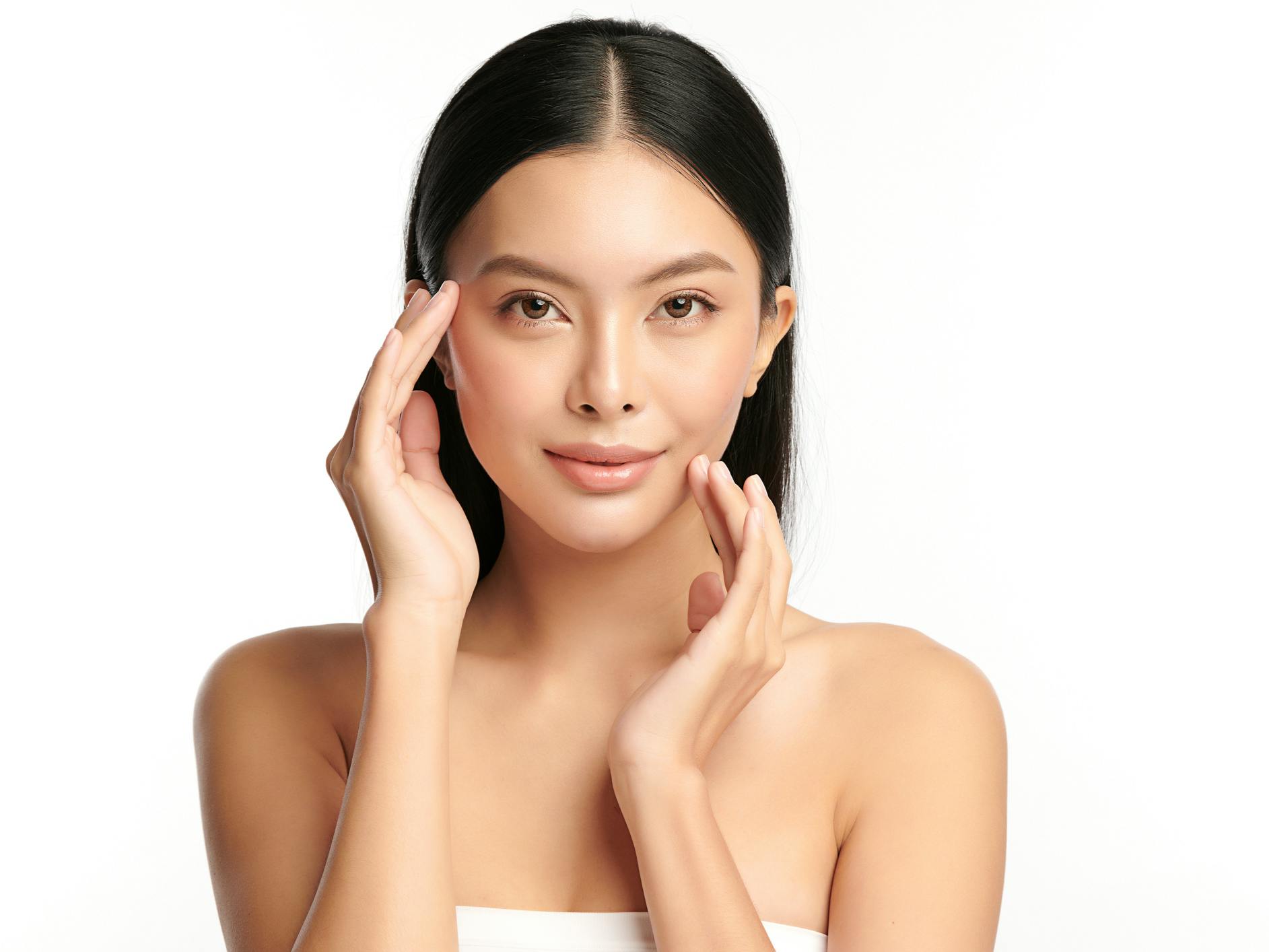 Woman with her hands on her chin and eyebrow