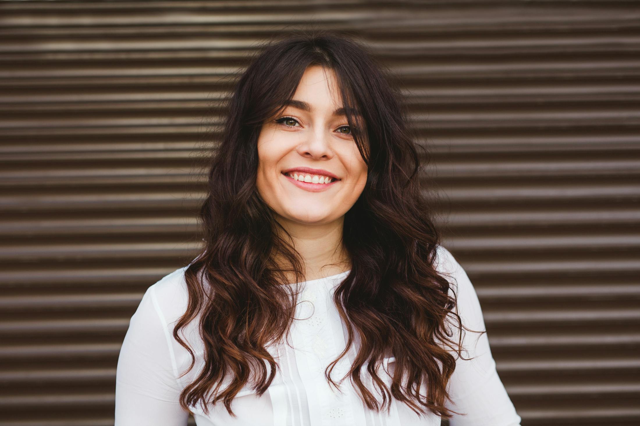 Woman with curly brown hair