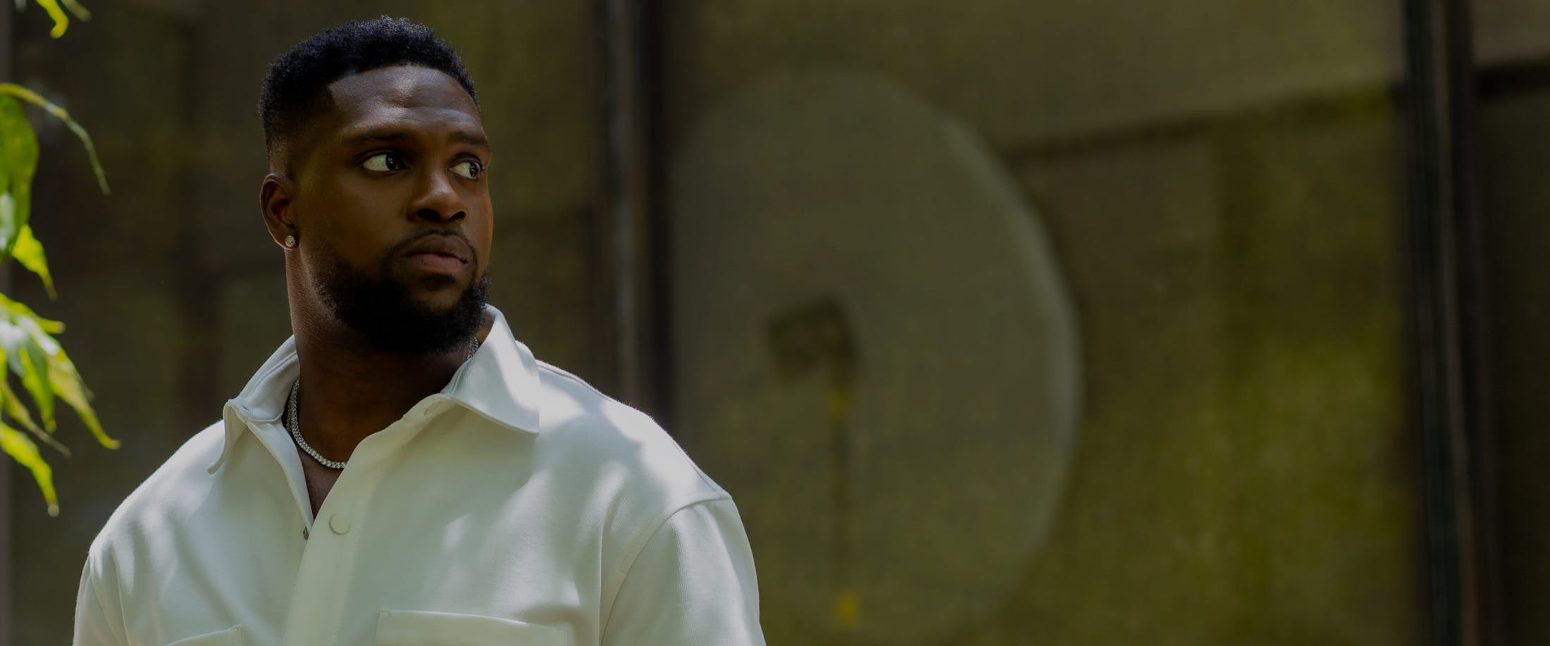 Man in a white shirt looking to the side