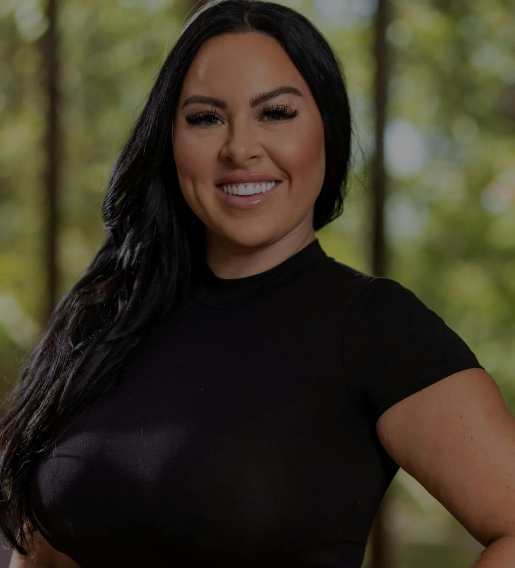 Woman in a black shirt smiling