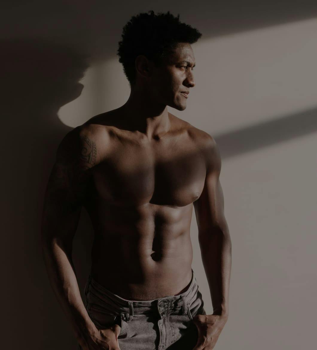 Shirtless man looking to the side