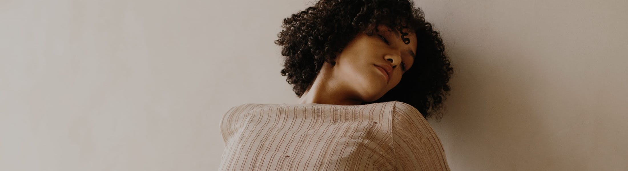 woman in tan sweater