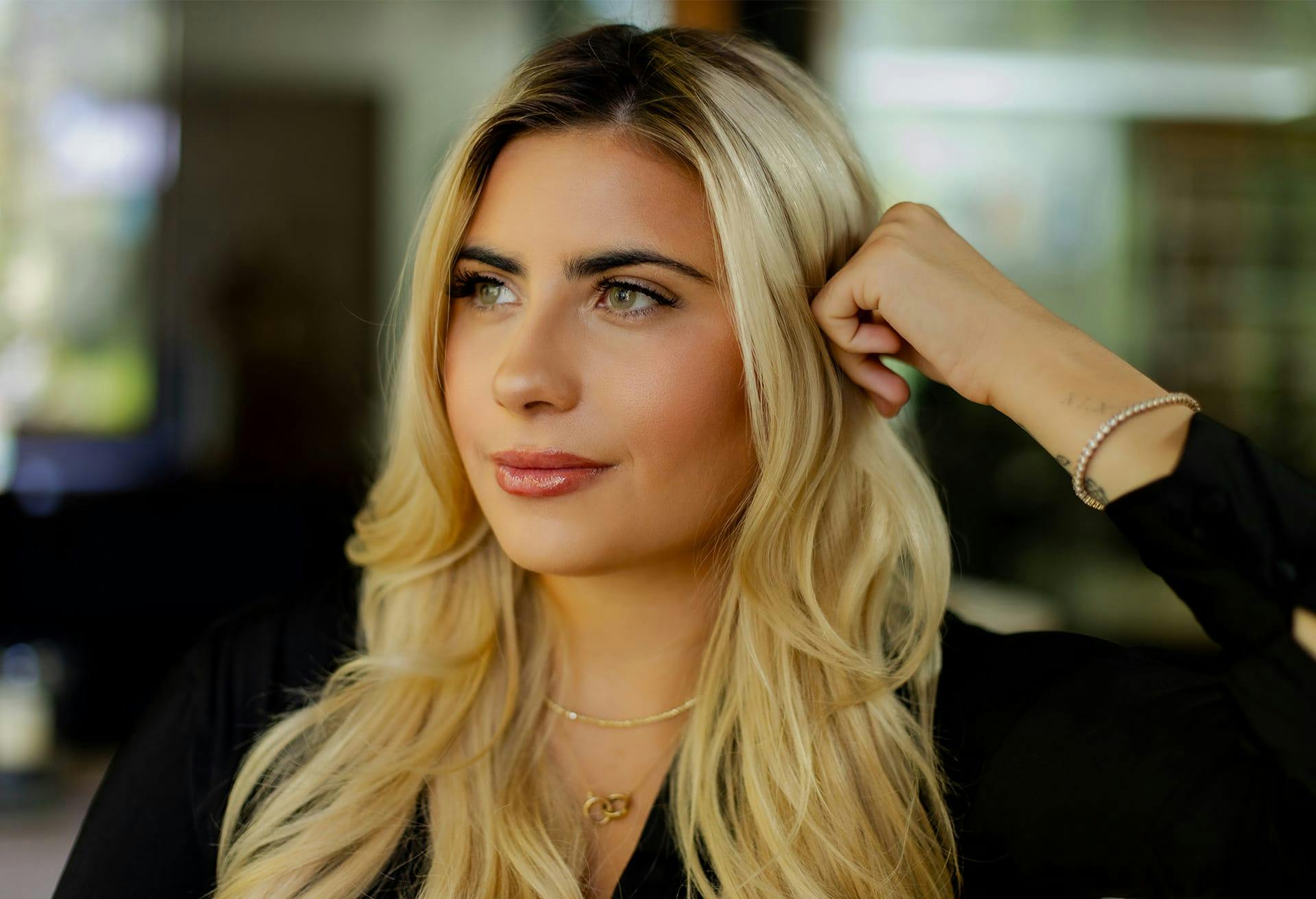 Blonde woman looking out of frame