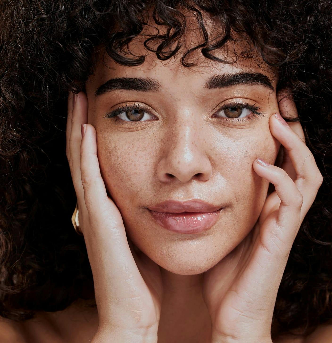Woman touching her face