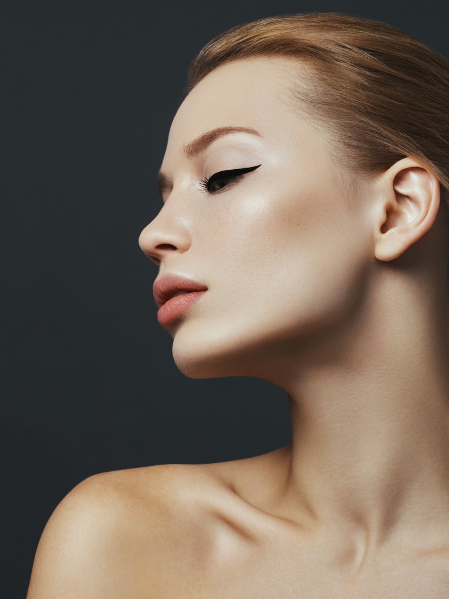 side profile model with red hair