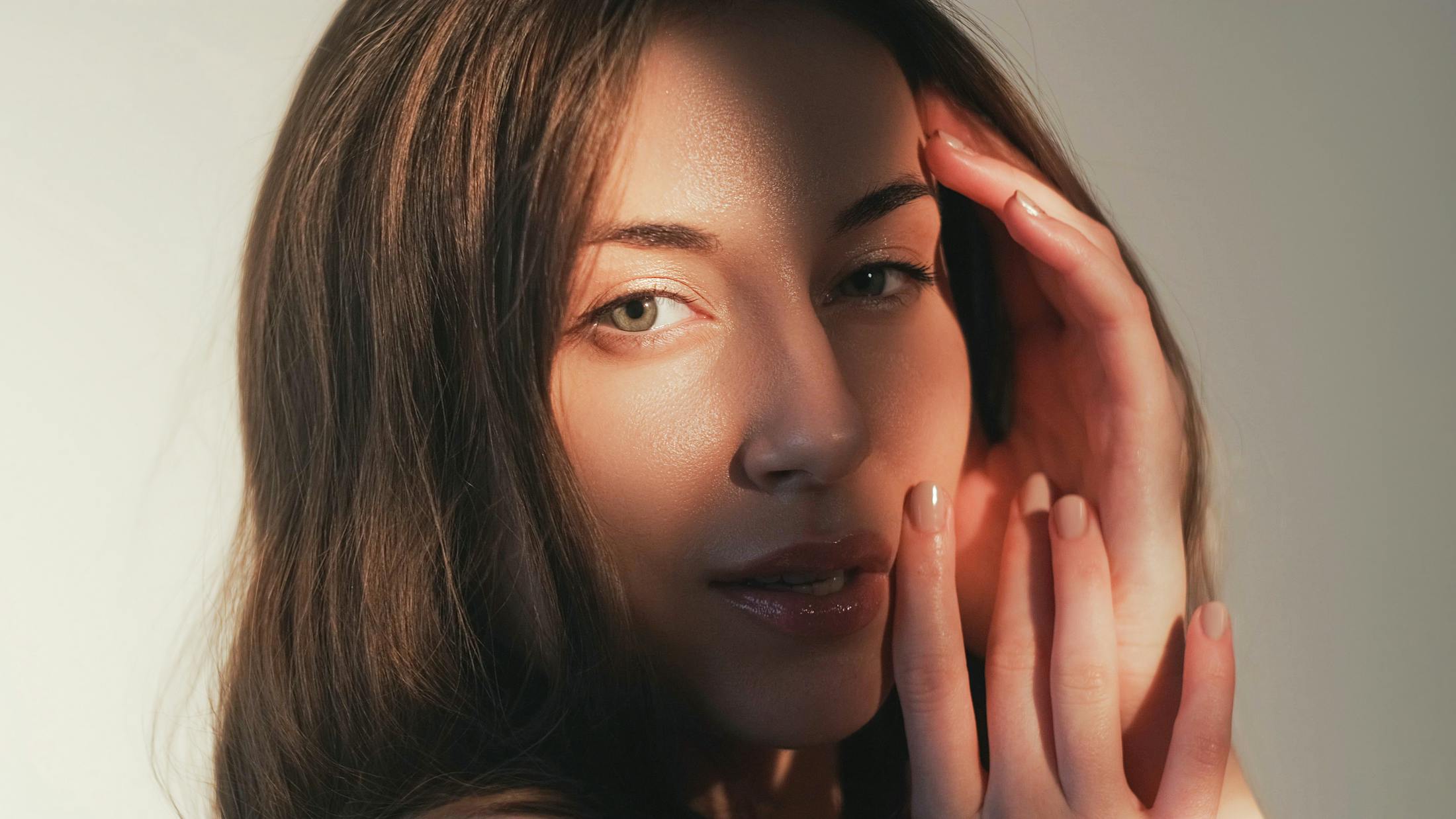 model with sun light on the center of her face