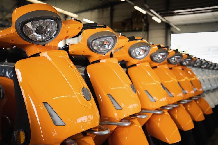 Orange and white e-mopeds