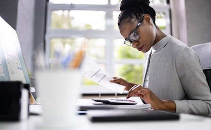 Woman using a calculator