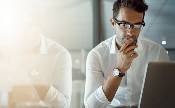 professor working on laptop