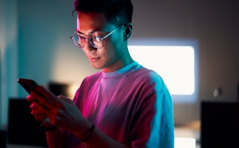 student looking at phone
