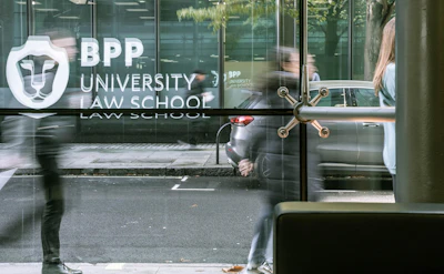Student walking into building