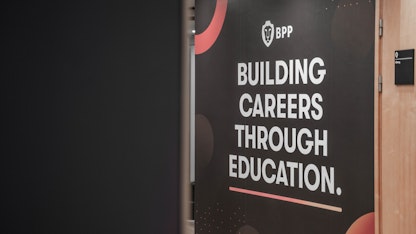 Building signage that reads Building Careers Through Education