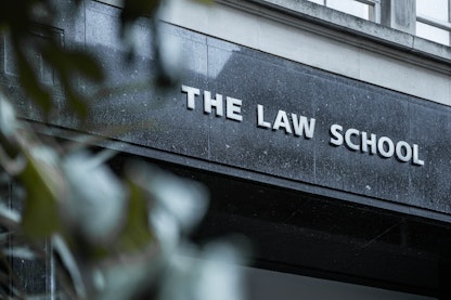The front of a building with a sign saying "The Law School"
