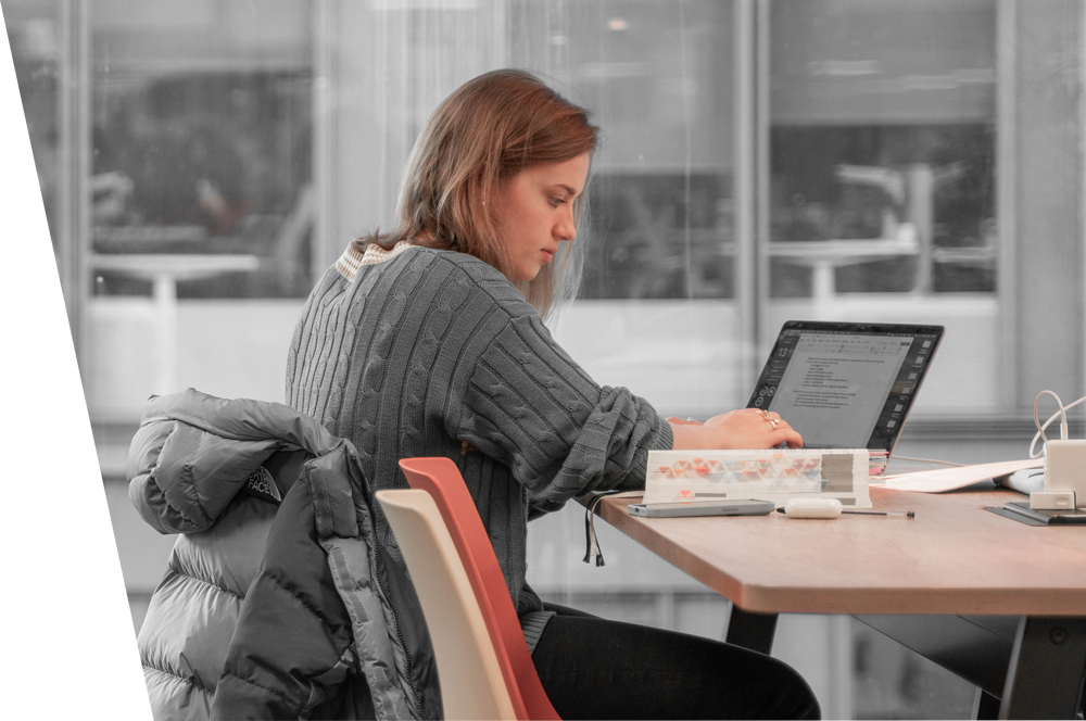 Female sitting at a desk on a laptop