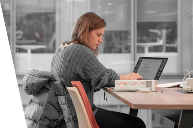 Female sitting at a desk on a laptop
